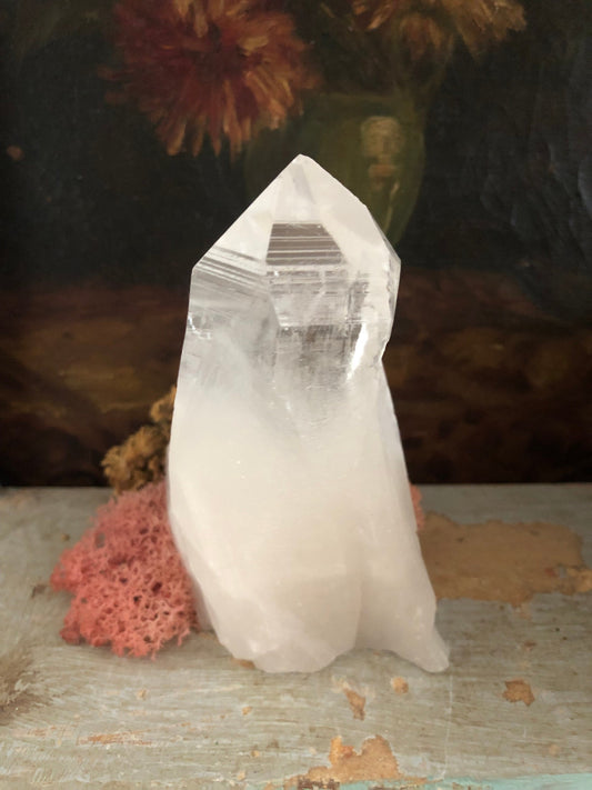 Brazilian quartz point with beautiful clarity and growth lines.