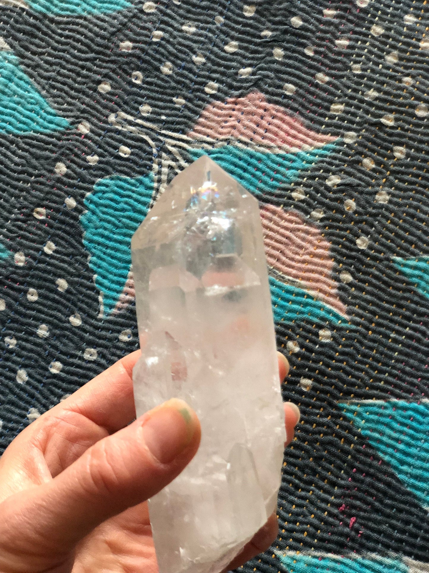 Quartz point with 7 smaller points (dolphin) rainbows.